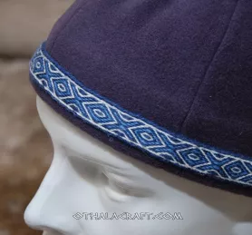 Dark purple woolen hat with braid.