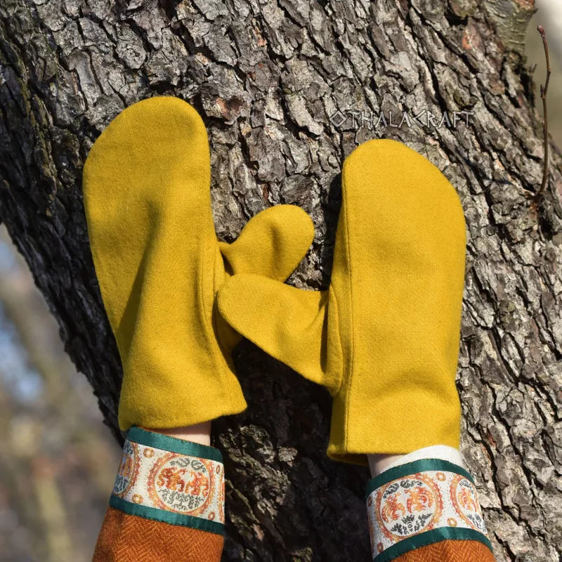 Warm gloves sewn from yellow wool