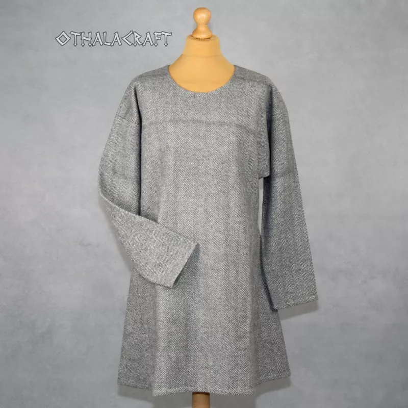 Hand sewn tunic, made of hand weaved 100 % woolen fabric in a herring bone pattern.