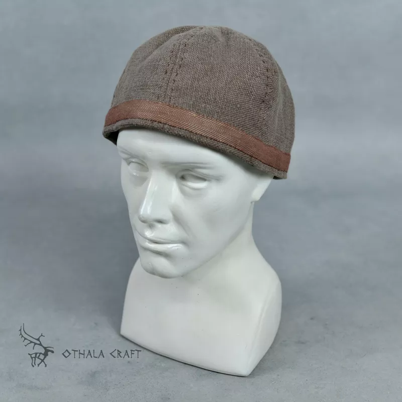 Simple hat made of light brown linen (100%) in visible pattern.