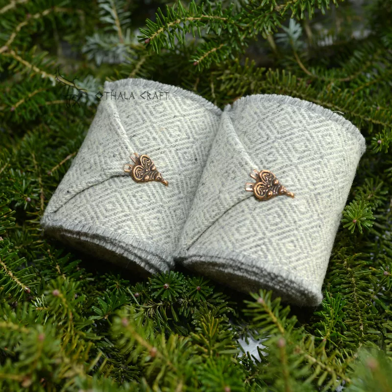 A pair of leg wraps, made from 100% wool in a diamond pattern. Natural shades of sheep's wool were used for the weaving.