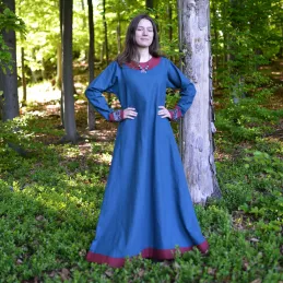 Beautiful viking dress, made of linen fabric in deep blue color, trimmed in dark red linen.