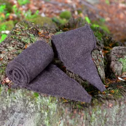 A pair of leg wraps, made from  wool in a diagonal pattern. Pleasant medium-weight wool in dark brown color, all hand-stitched