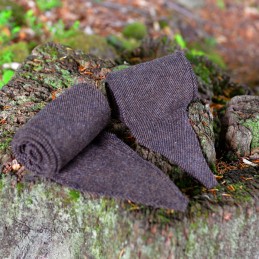 A pair of leg wraps, made from  wool in a diagonal pattern. Pleasant medium-weight wool in dark brown color, all hand-stitched