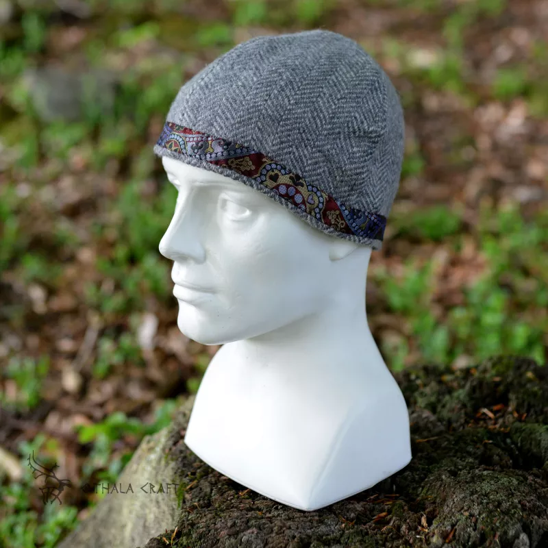 Simple hat made of hand weaved wool in herring bone pattern.