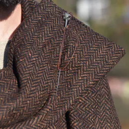 Brown woolen cape in herring bone pattern