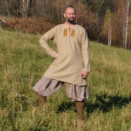 Decorative Viking tunic made of beige wool with a herringbone pattern.
