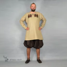 Trousers made from brown linen and dark red linen. Shape based on find from Haithabu, short tided under the knee.