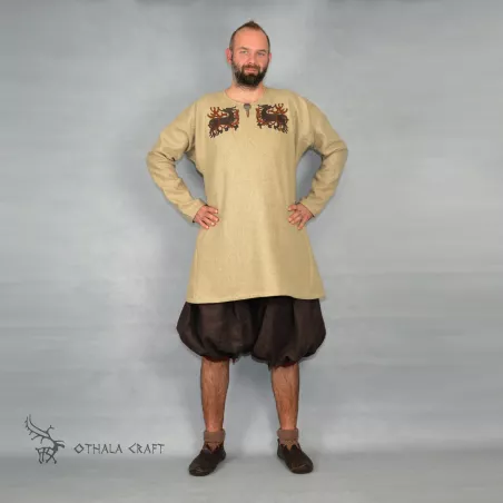 Trousers made from brown linen and dark red linen. Shape based on find from Haithabu, short tided under the knee.