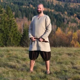 Trousers made from brown wool in herringbone pattern. Shape based on find from Haithabu, short tided under the knee.