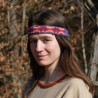 The headband is made of linen in blue color, decorated with layer of woven in a pattern of ancient silk.