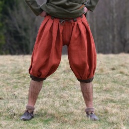 Trousers made of linen with a beige herringbone weave. Shape based on find from Haithabu, short tided under the knee.