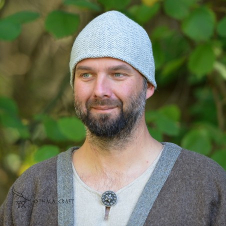 Viking woolen hat made of grey hand-woven herringbone wool, half lined with linen.